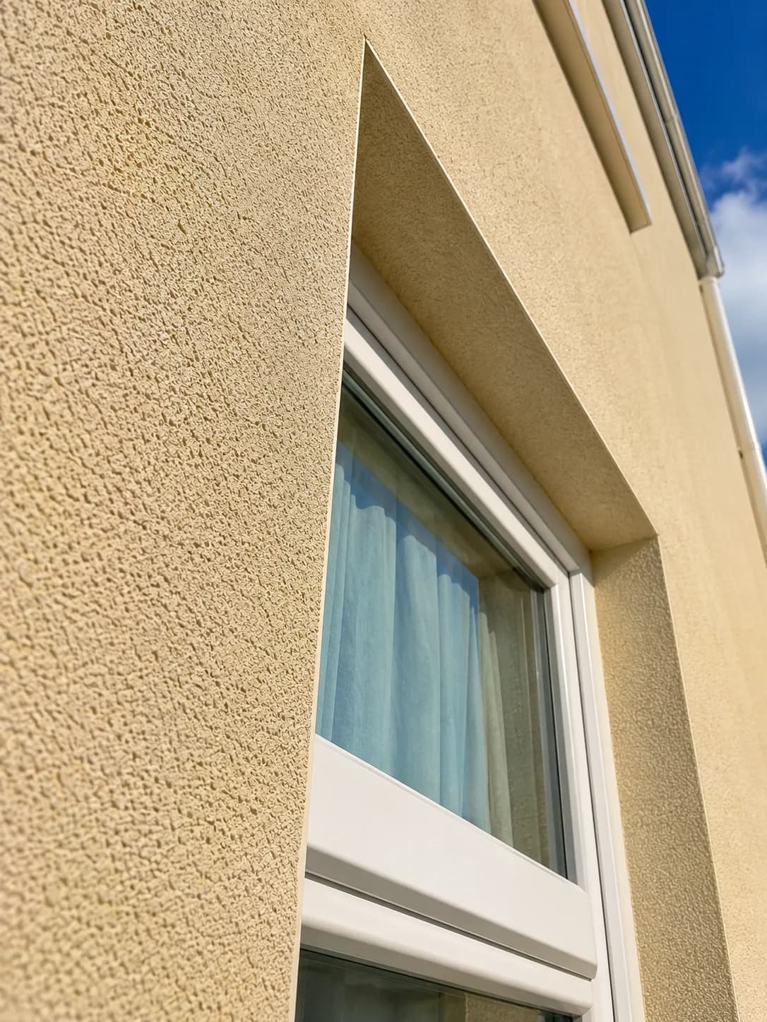 Render texture close-up showing fine silicone finish around window